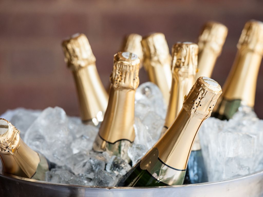 sparkling pinot noir wine bottles in an ice bucket