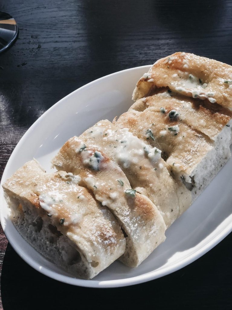 a loaf of bread being served at Kincaid's Burlingame