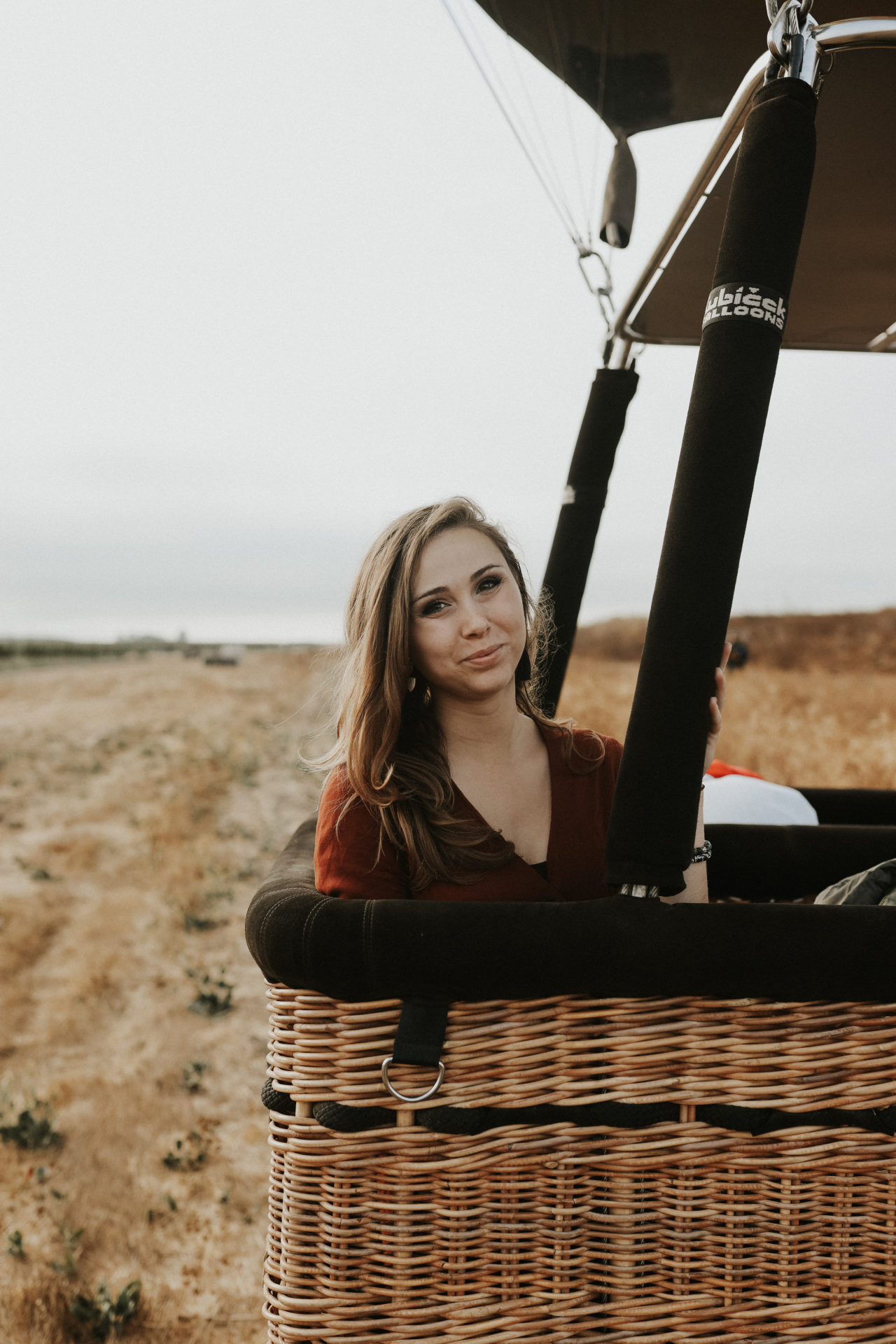 a girl sitting inside of a hot air balloon in Sonoma