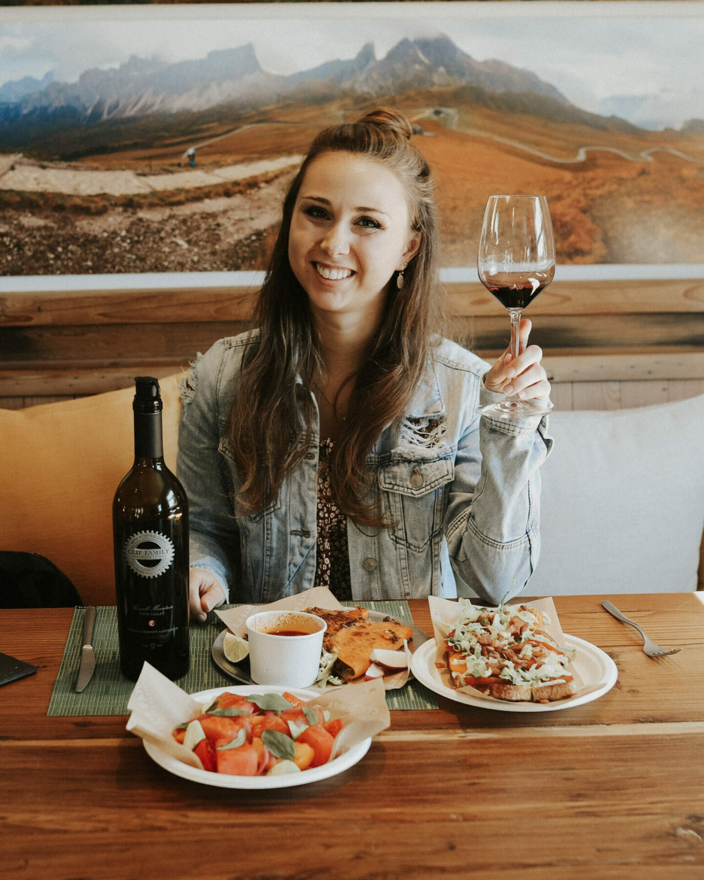 Paige with food and wine at Clif Family winery - best Napa wineries