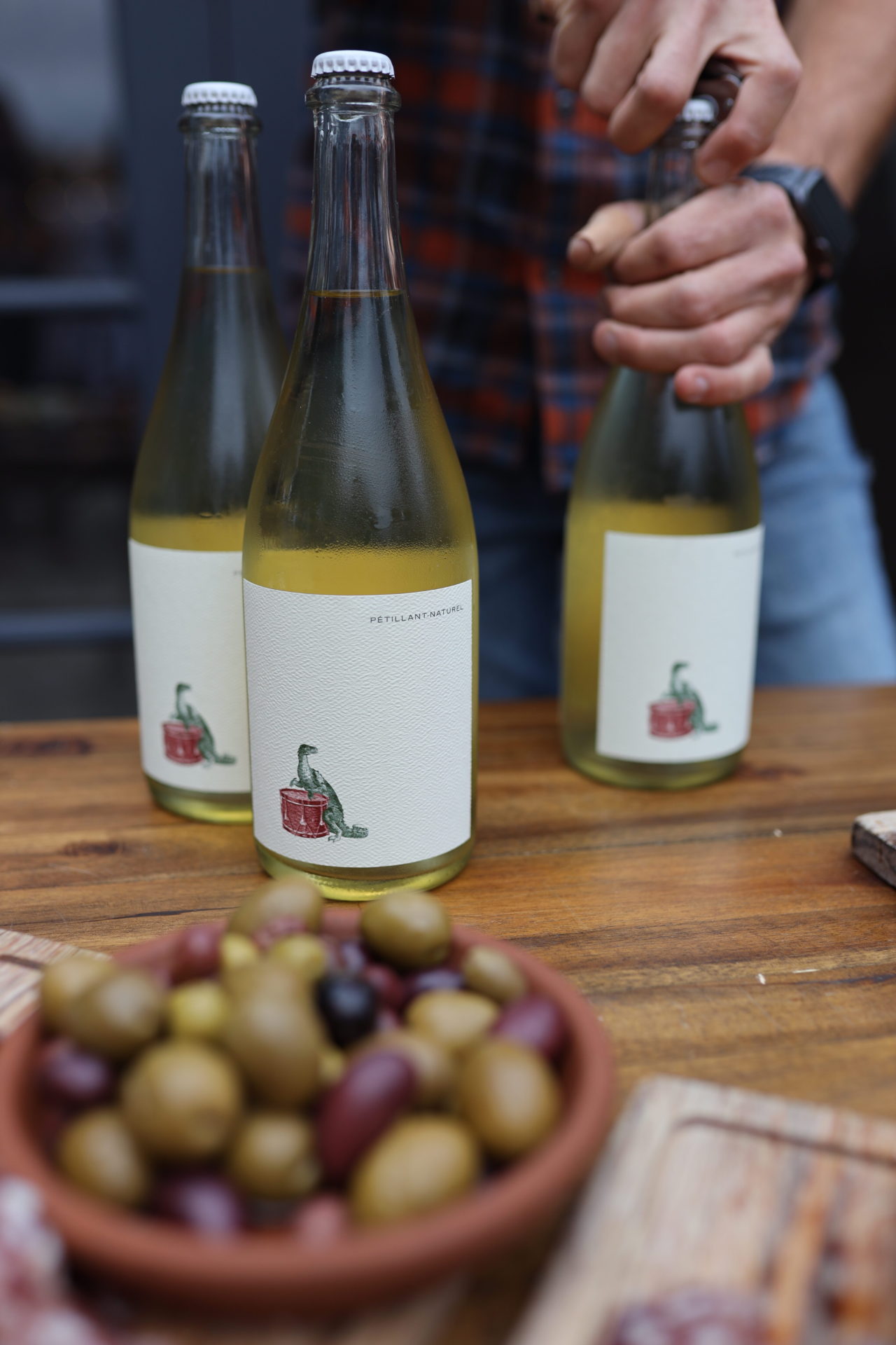 Wine bottles and olives being consumed at Folktale Winery