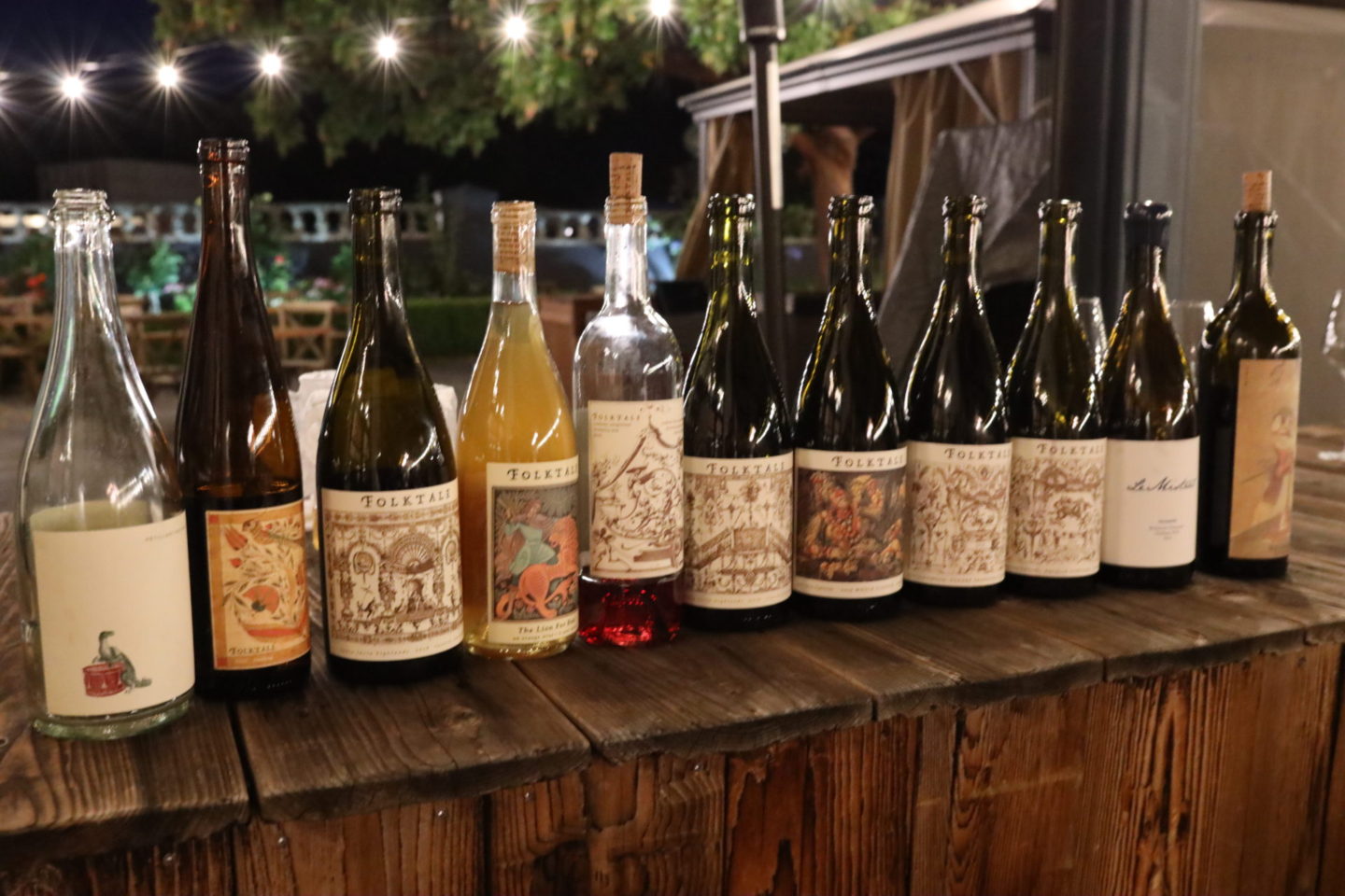 lineup of wine bottles at Folktale Winery