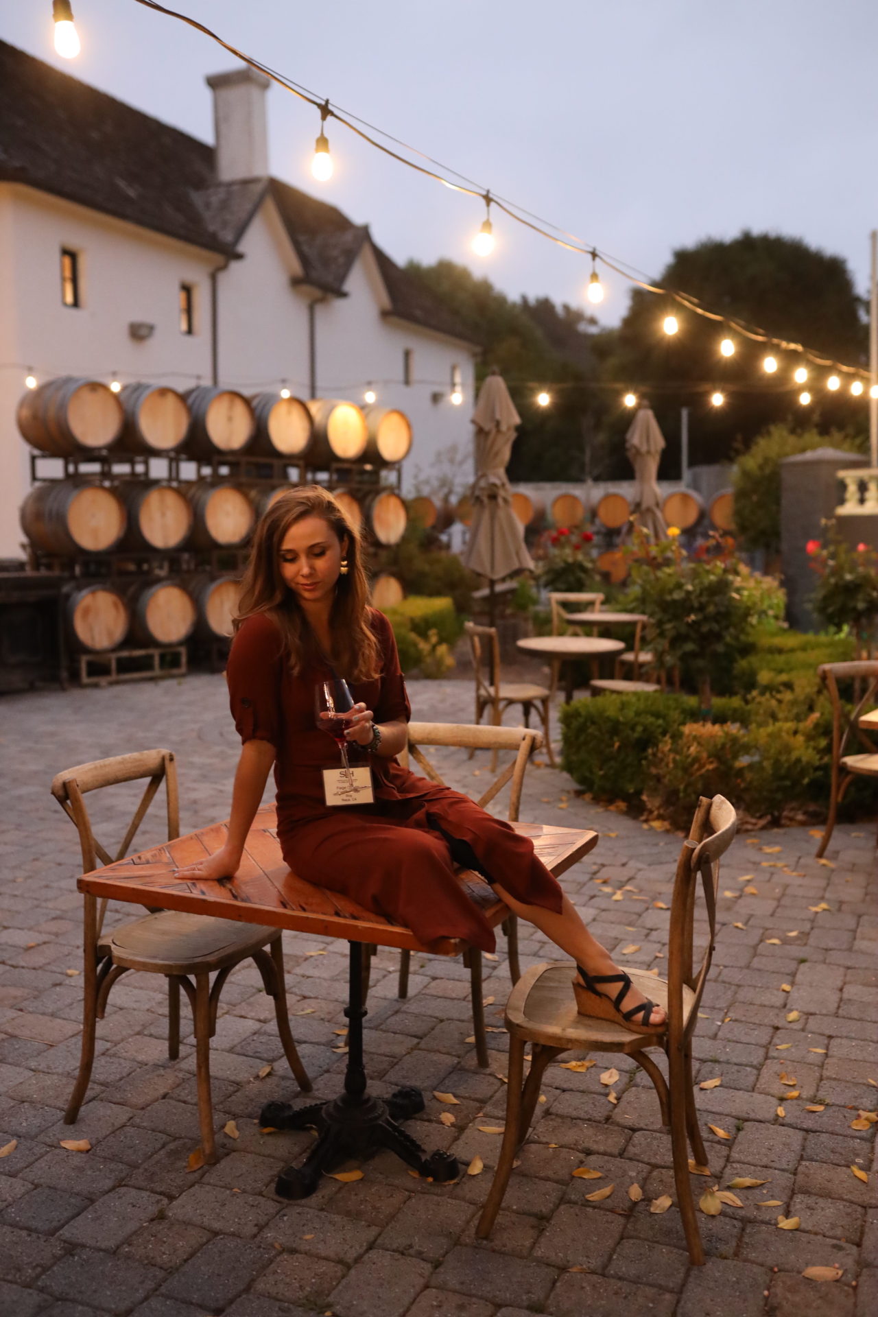 Girl sitting on a table at Folktale Winery