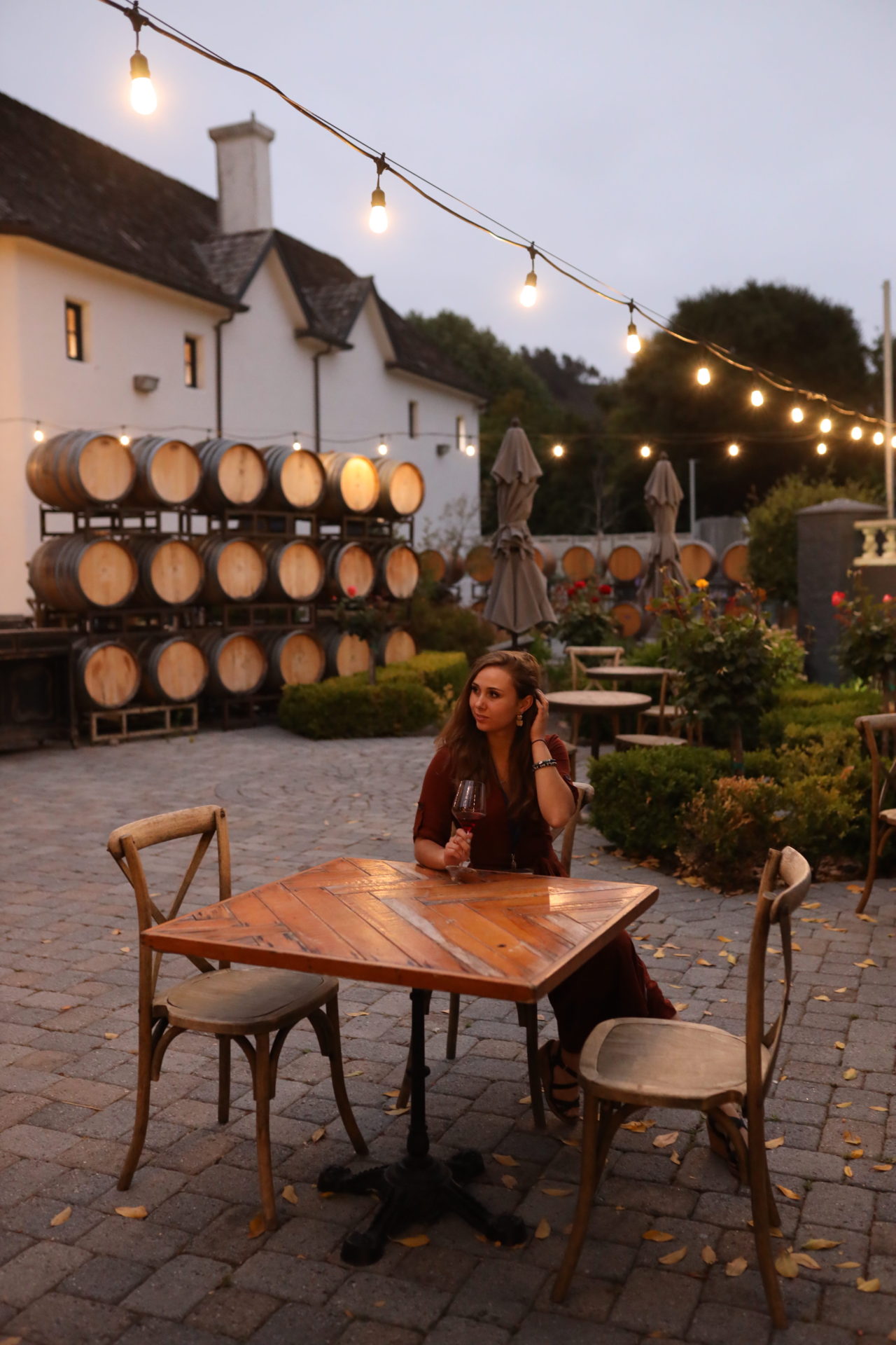 girl sitting at a table at Folktale Winery