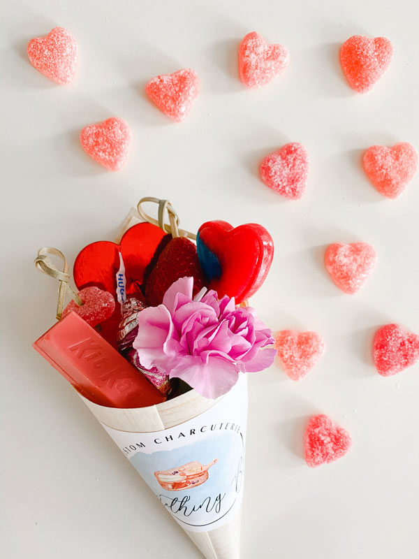 charcuterie bouquet with candy and flowers