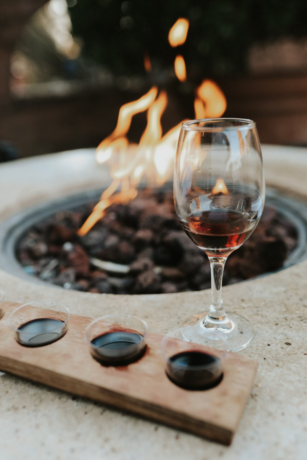 Viaggio tasting flight in front of fire pit