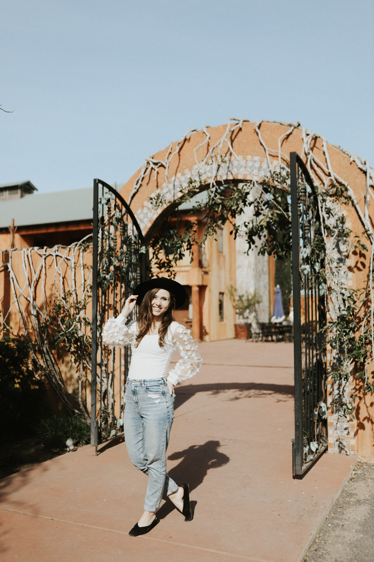 a girl posing in front of a Lodi Hotel