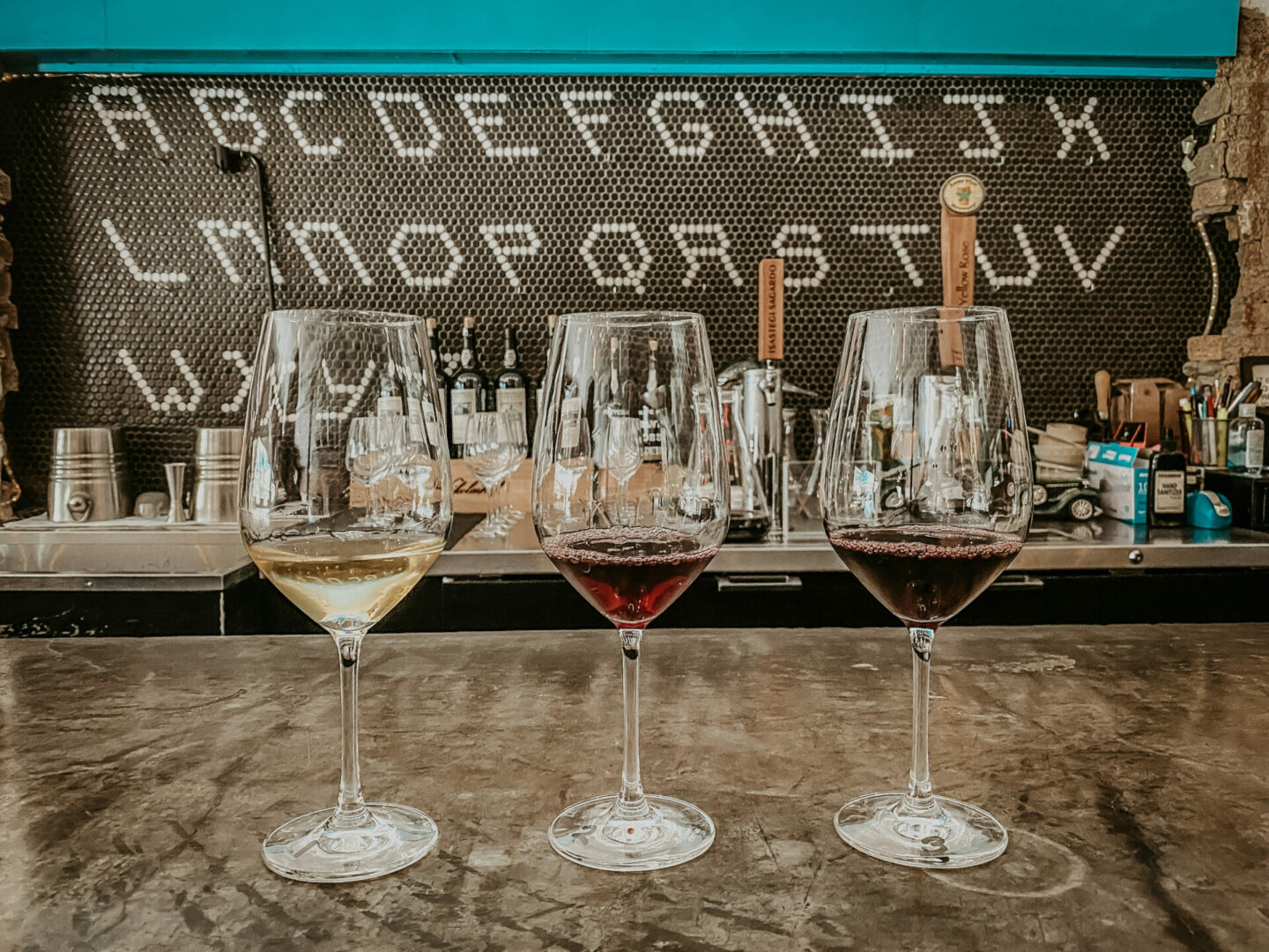 a flight of wine from Camerata, on a list of Houston wine bars
