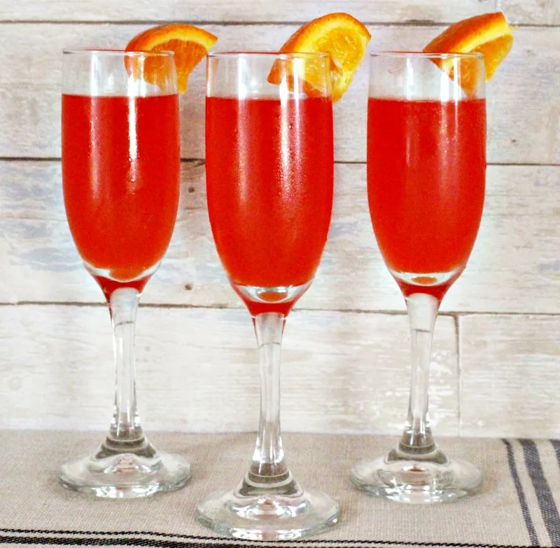 A lineup of red mimosas to go with a Mother's Day Charcuterie board