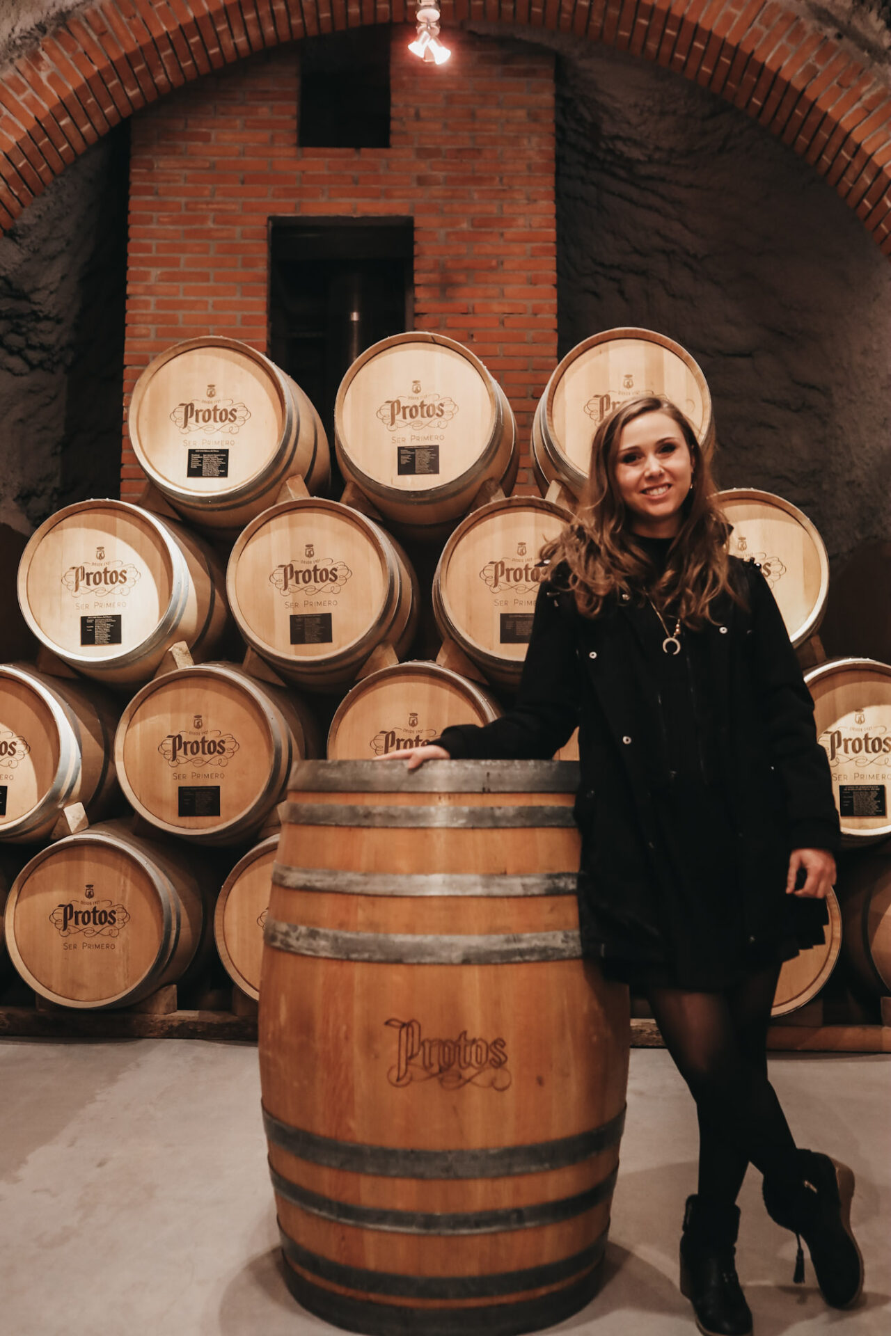 Paige at Bodega Protos in barrel room