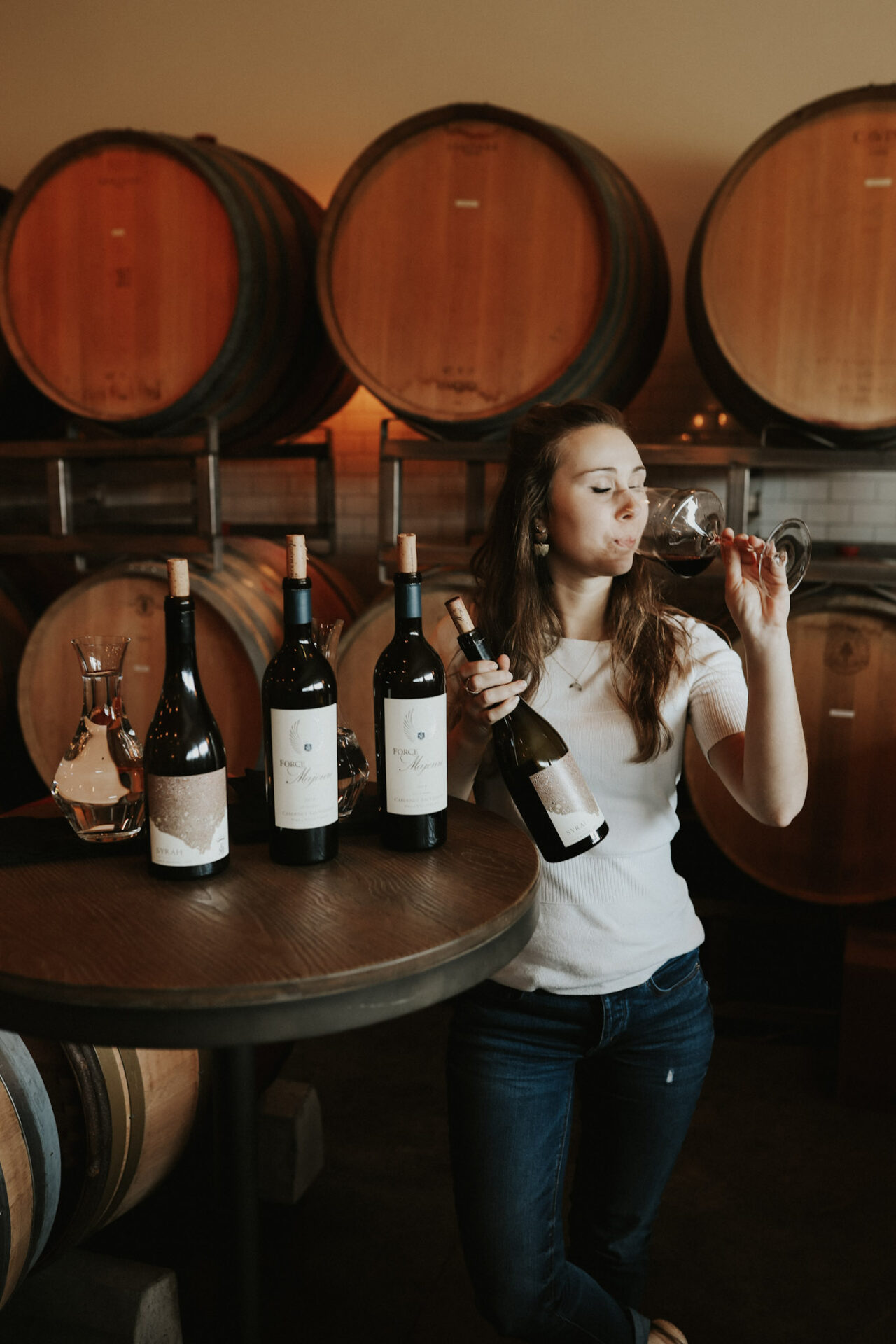 Paige sipping Force Majeure Syrah in Walla Walla winery