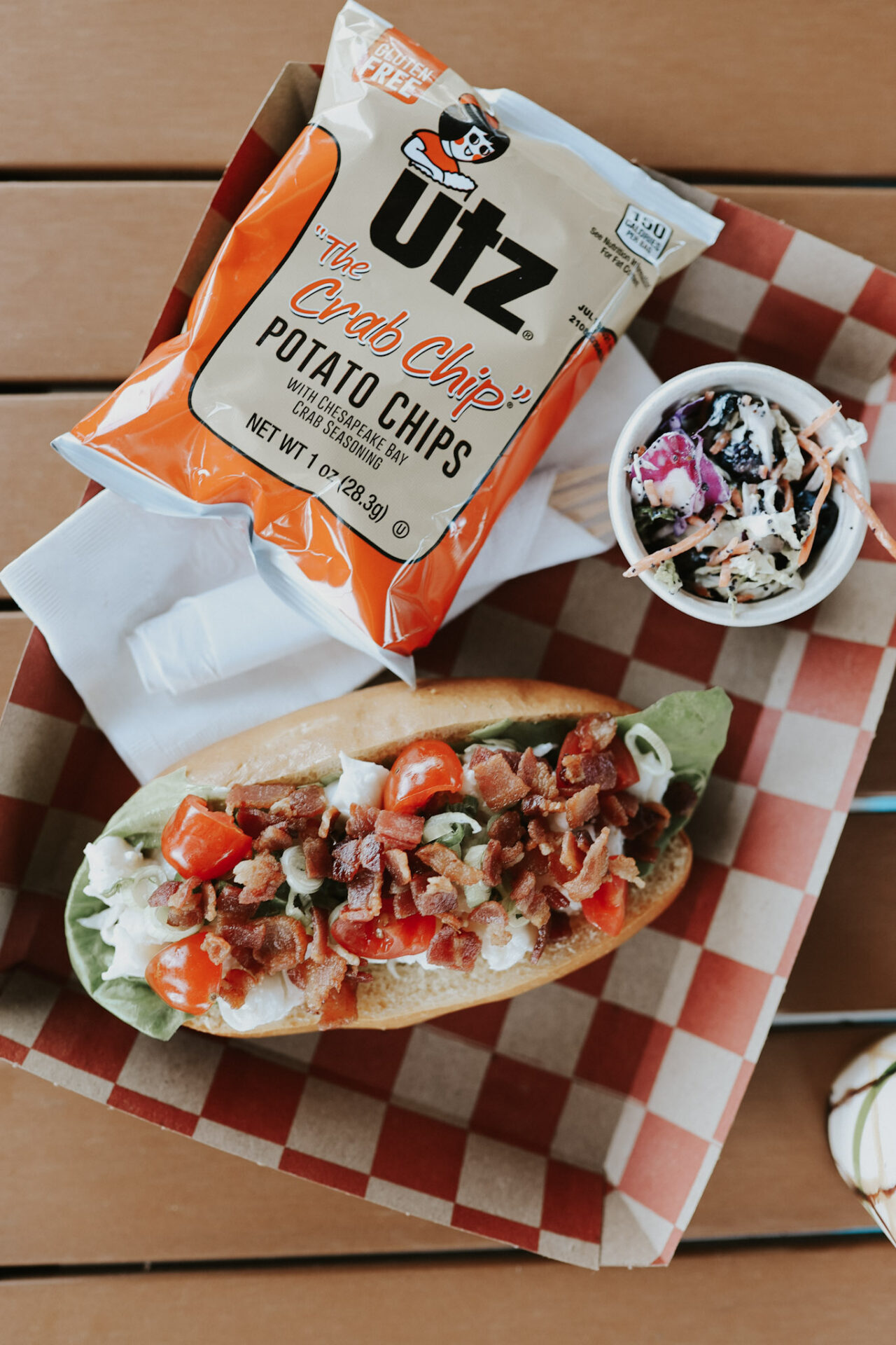 Lobster roll and chips with a side of coleslaw at Delicious DIsh in Sonoma