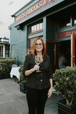 Sommelier Debbie Zachareas in front of Izzy's Steakhouse in San Francisco