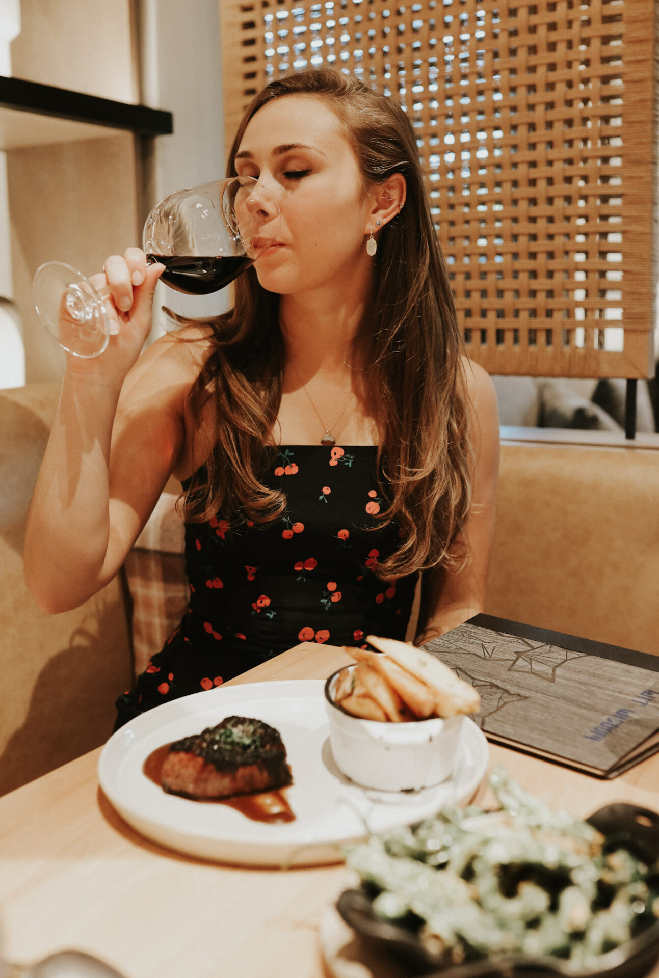 Paige eating steak and fries at Wit and Wisdom restaurant in downtown Sonoma