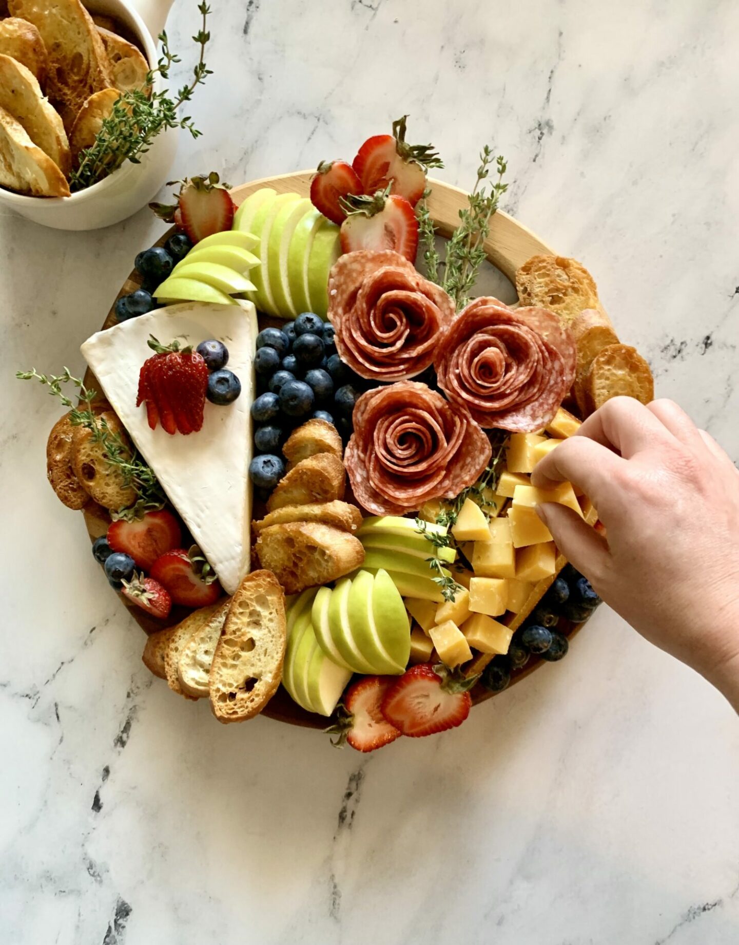 Trader Joe's Charcuterie Board with meat and cheeses brie salami roses