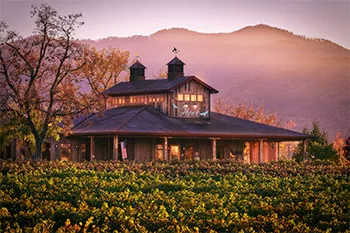 2Hawk Winery & Vineyards tasting room in Southern Oregon mountains in background