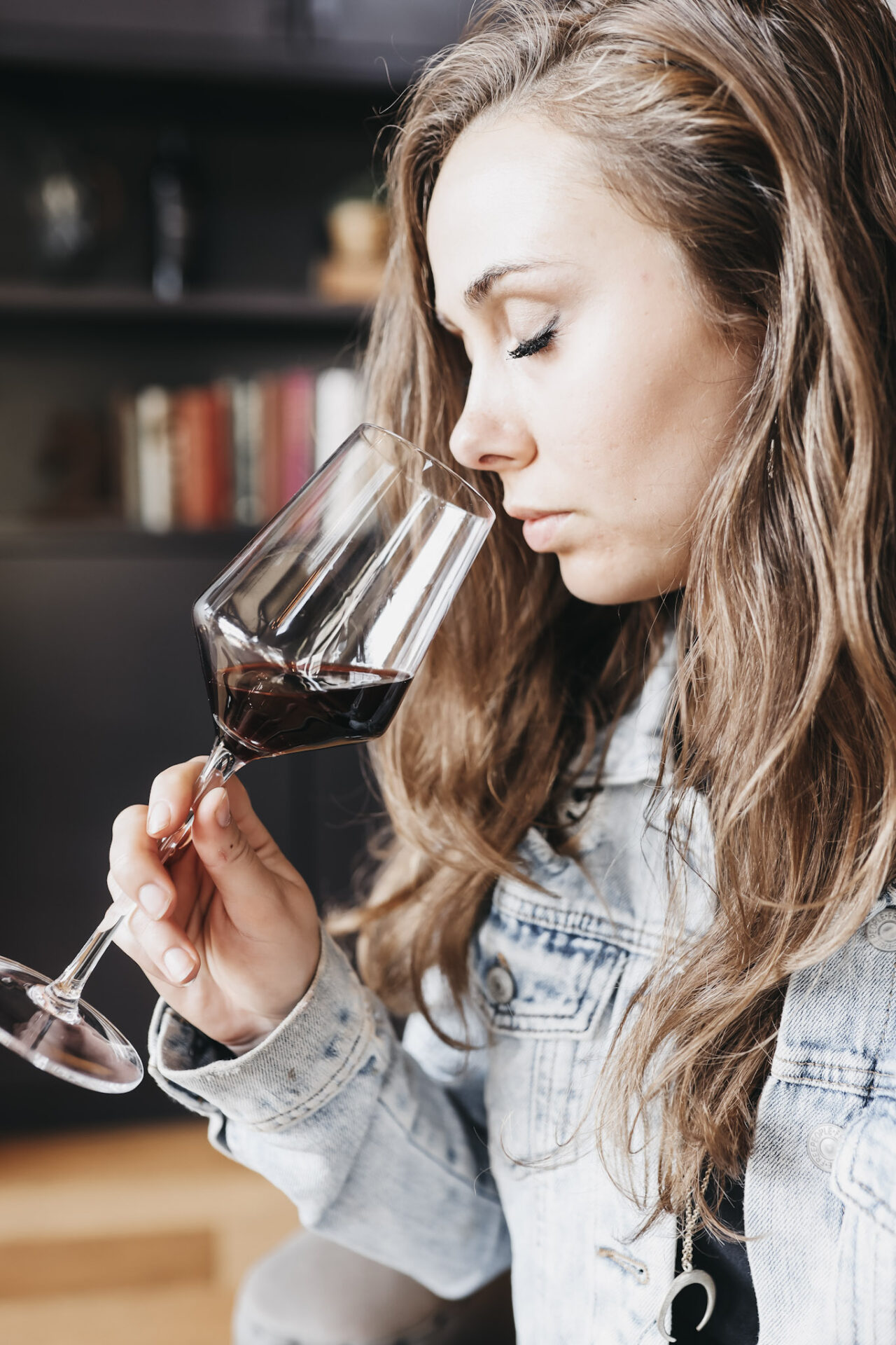 Paige smelling wine out of wine tasting glass