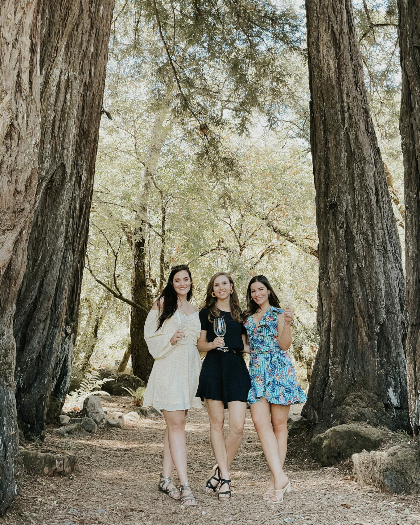 Paige and friends at AXR Winery in a fairy circle of trees