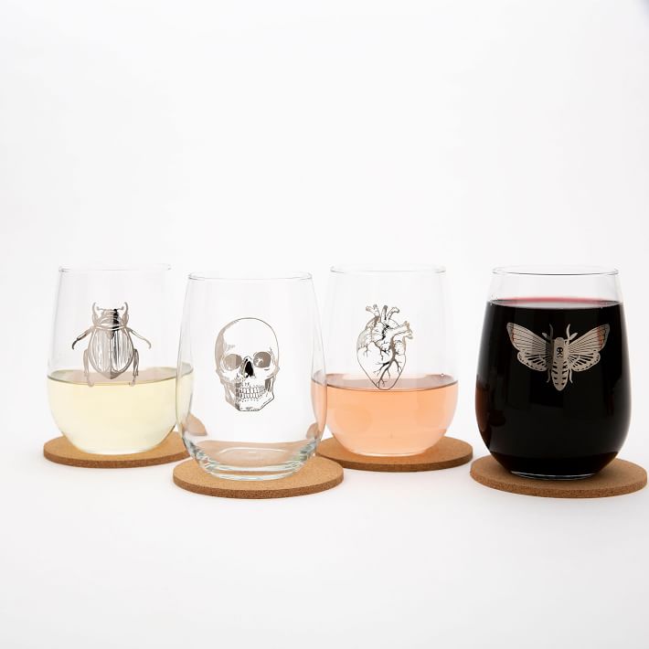 Chic & Spooky Stemless Wine Glasses featuring the outlines of a skull, heart, butterfly, and bug