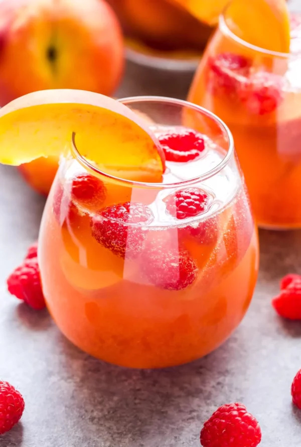 Coppa Cocktail in wine glass with fruit