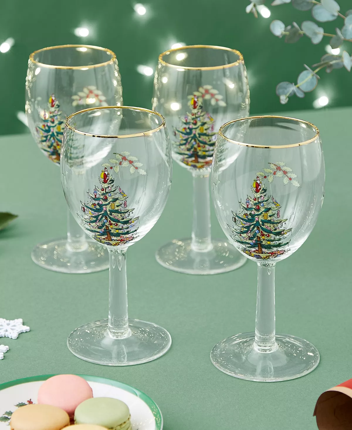 Set of four stemmed wine glasses featuring painted Christmas Trees