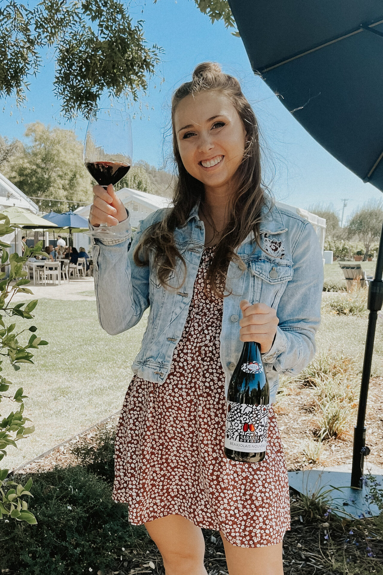 Paige holding Georges Duboeuf Beaujolais Nouveau 2022