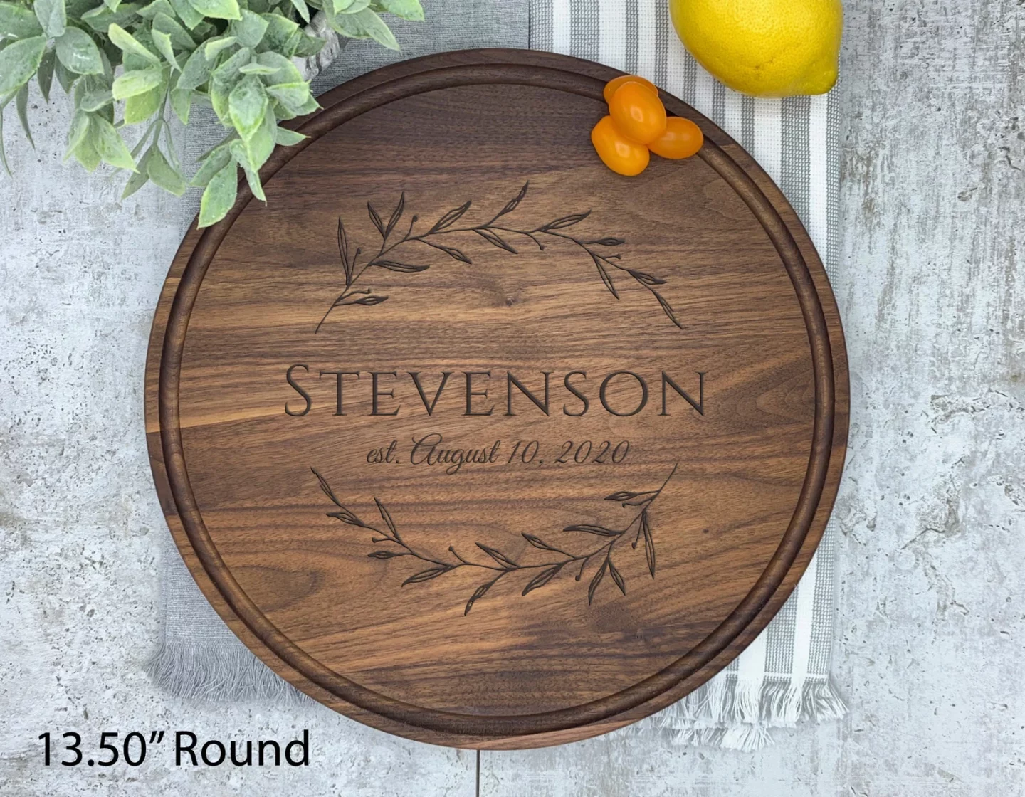 Round, wallet charcuterie board featuring personalization in the middle