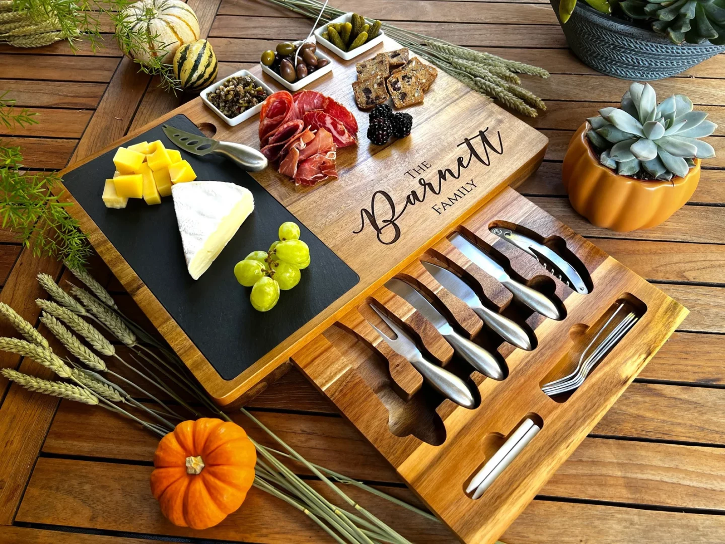 Personalized board featuring slate inlet and pull-out cheese knife drawer