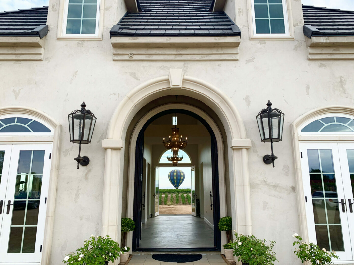 Exterior of European Style Estate with view of hot air ballon in background