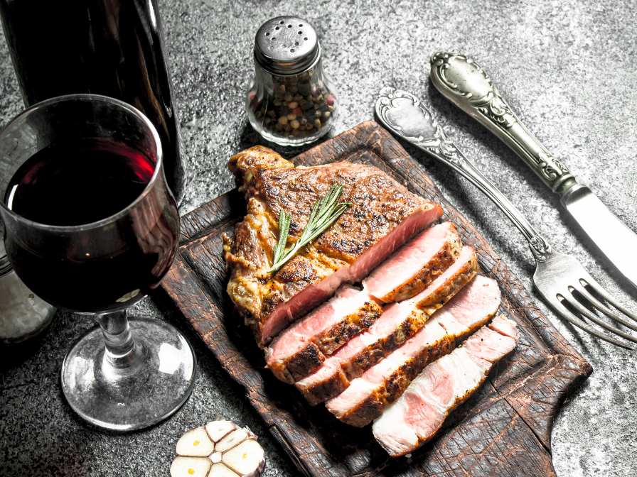 Dornfelder wine paired with baked pork sliced with rosemary