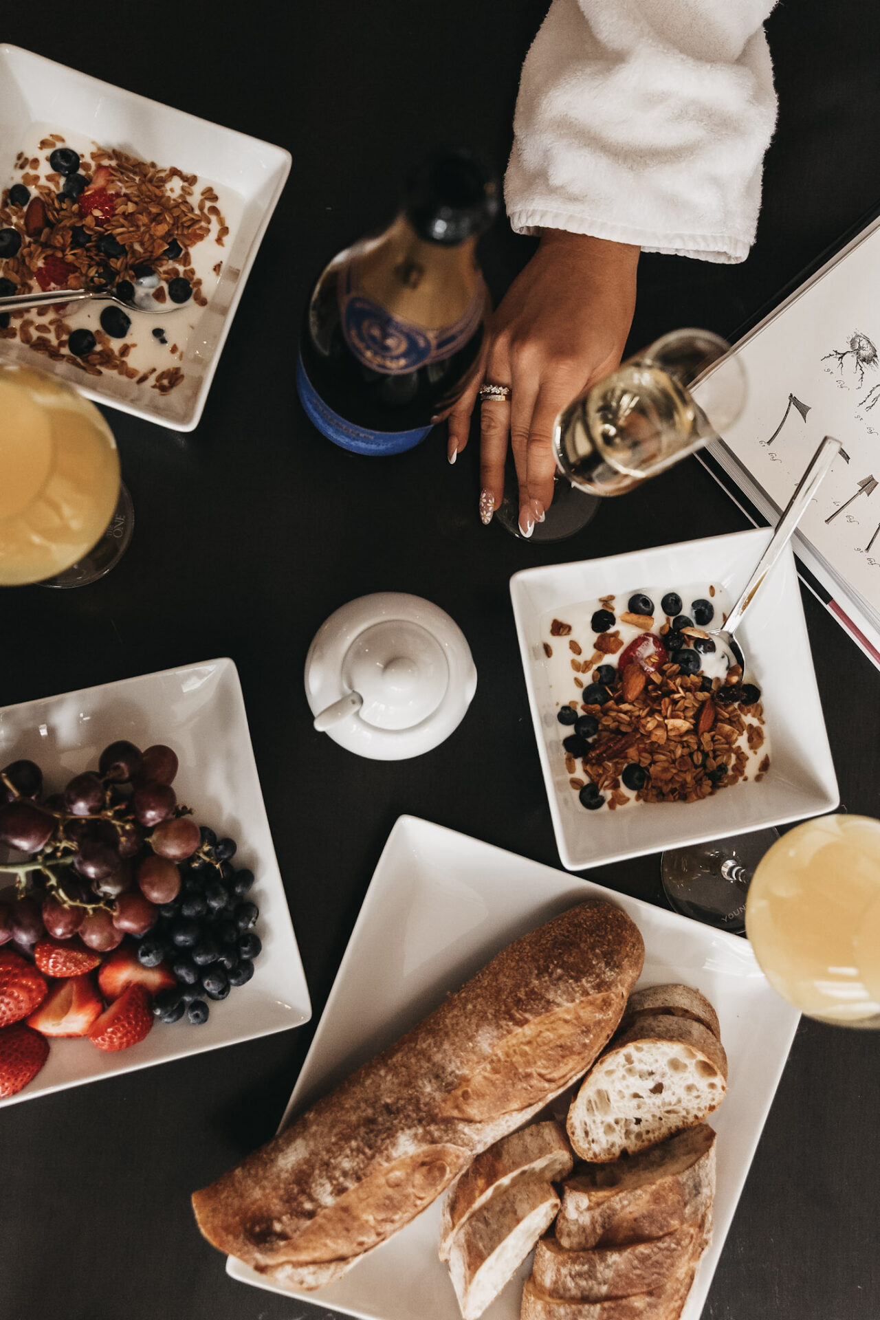 The best prosecco for mimosas with woman's hand over breakfast foods
