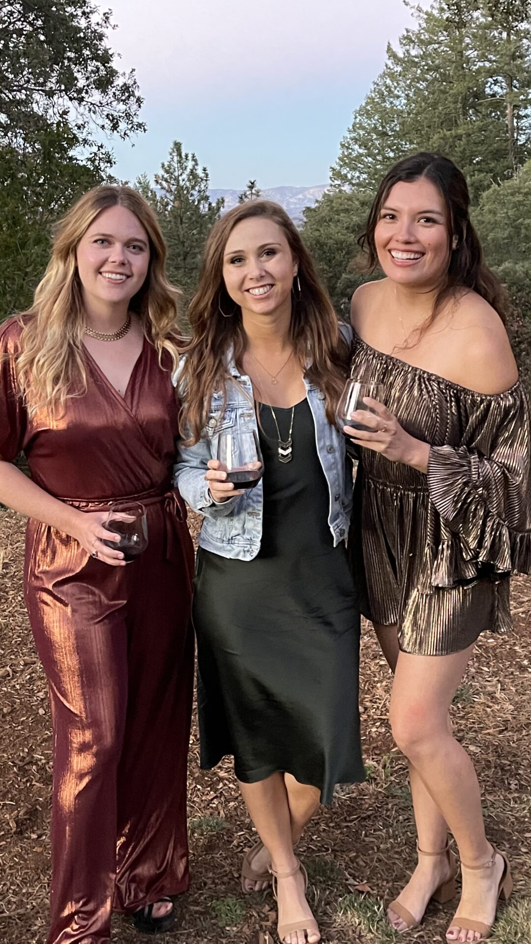 Paige and her friends enjoying wine in a vineyard
