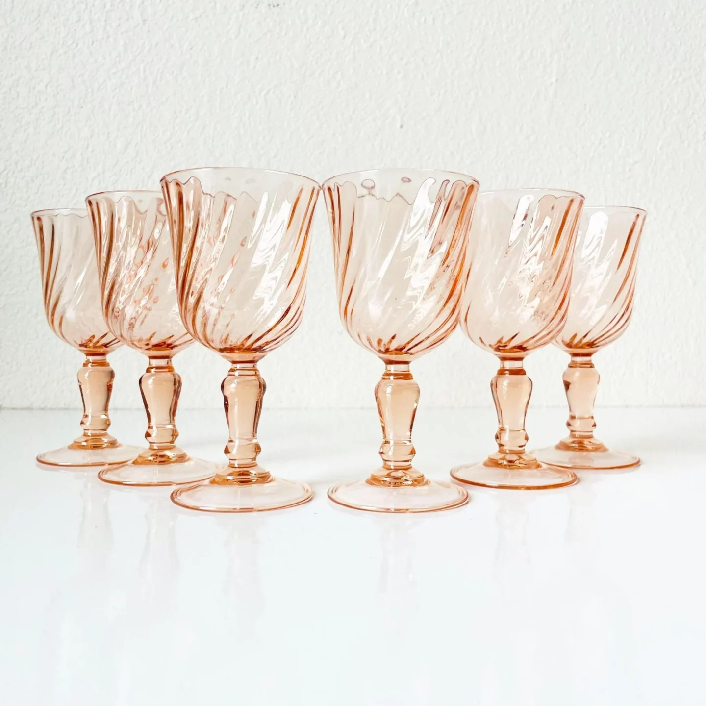 Set of six rose colored wine glasses