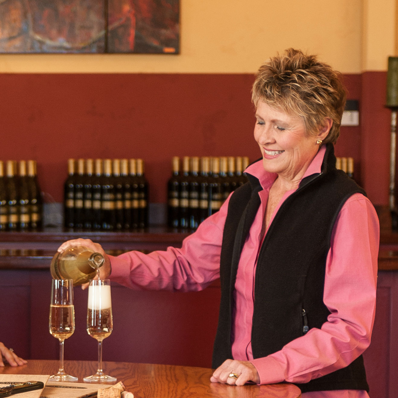 Vicky Farrow pouring sparkling wine