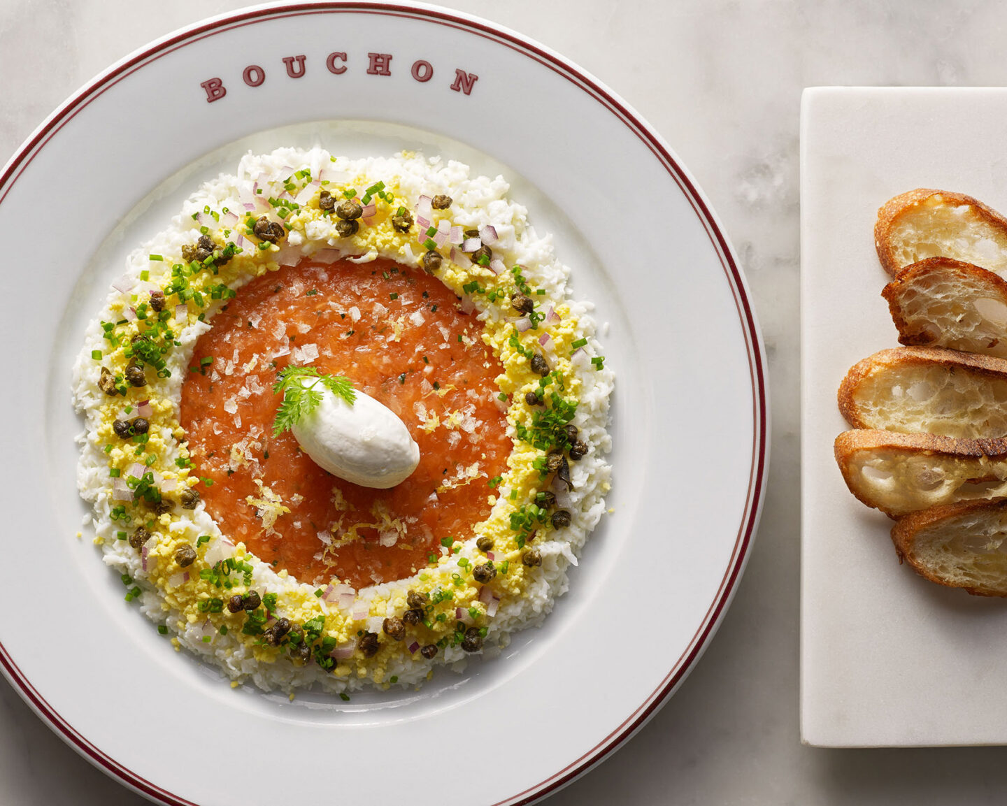 Plate of food with side of bread at Bouchon Bistro in Yountville, CA