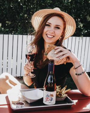 Paige enjoying a burger, fries, and red wine at Gott's Roadside in St Helena, CA