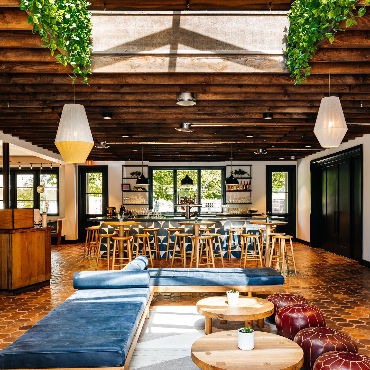 View of restaurant with traditional tables and informal couch seating area