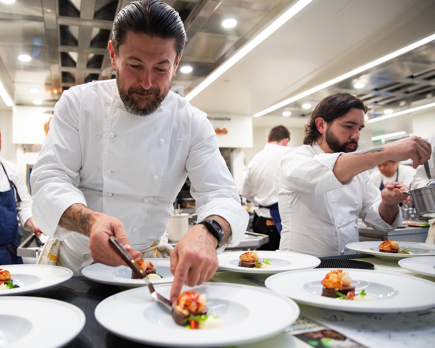 Chefs preparing plates at The French Laundry in Yountville, CA