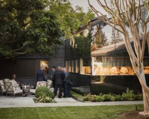 Exterior shot of The French Laundry with views into the kitchen