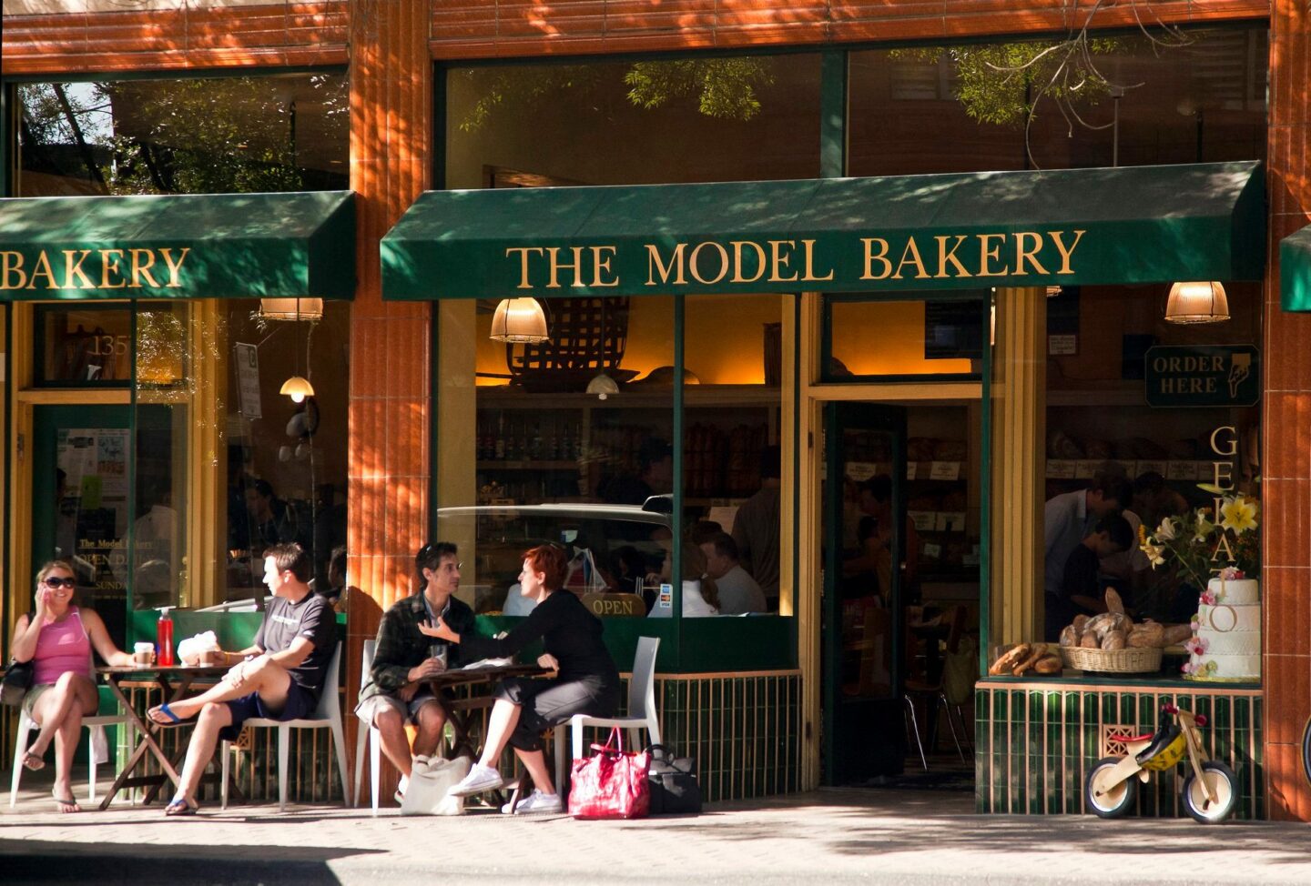 People enjoying coffee and pastry outside Model Bakery in St Helena CA