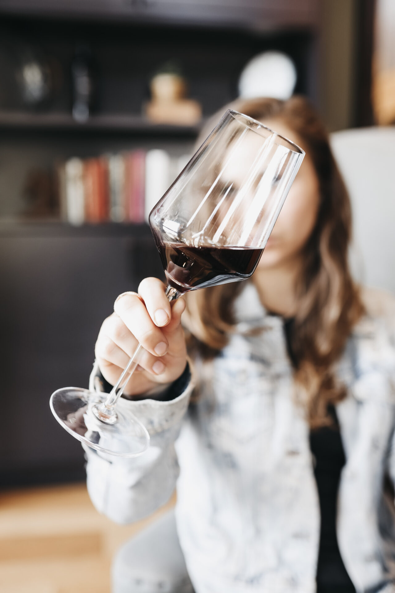 Paige swirling a glass of red wine