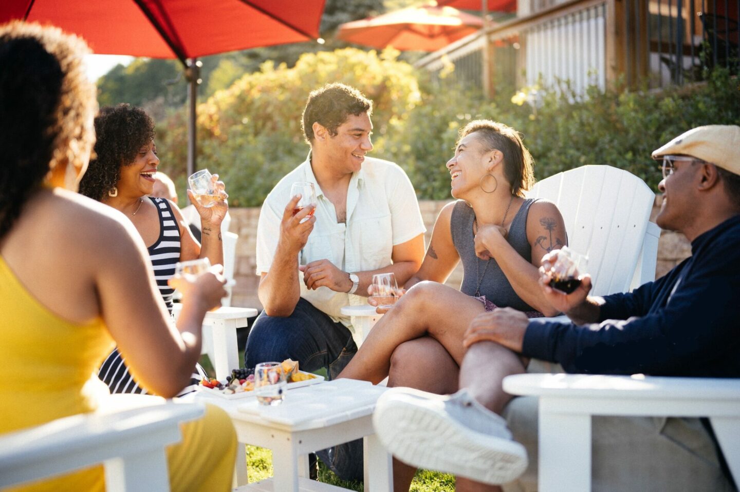 People enjoying a wine tasting on an outdoor patio