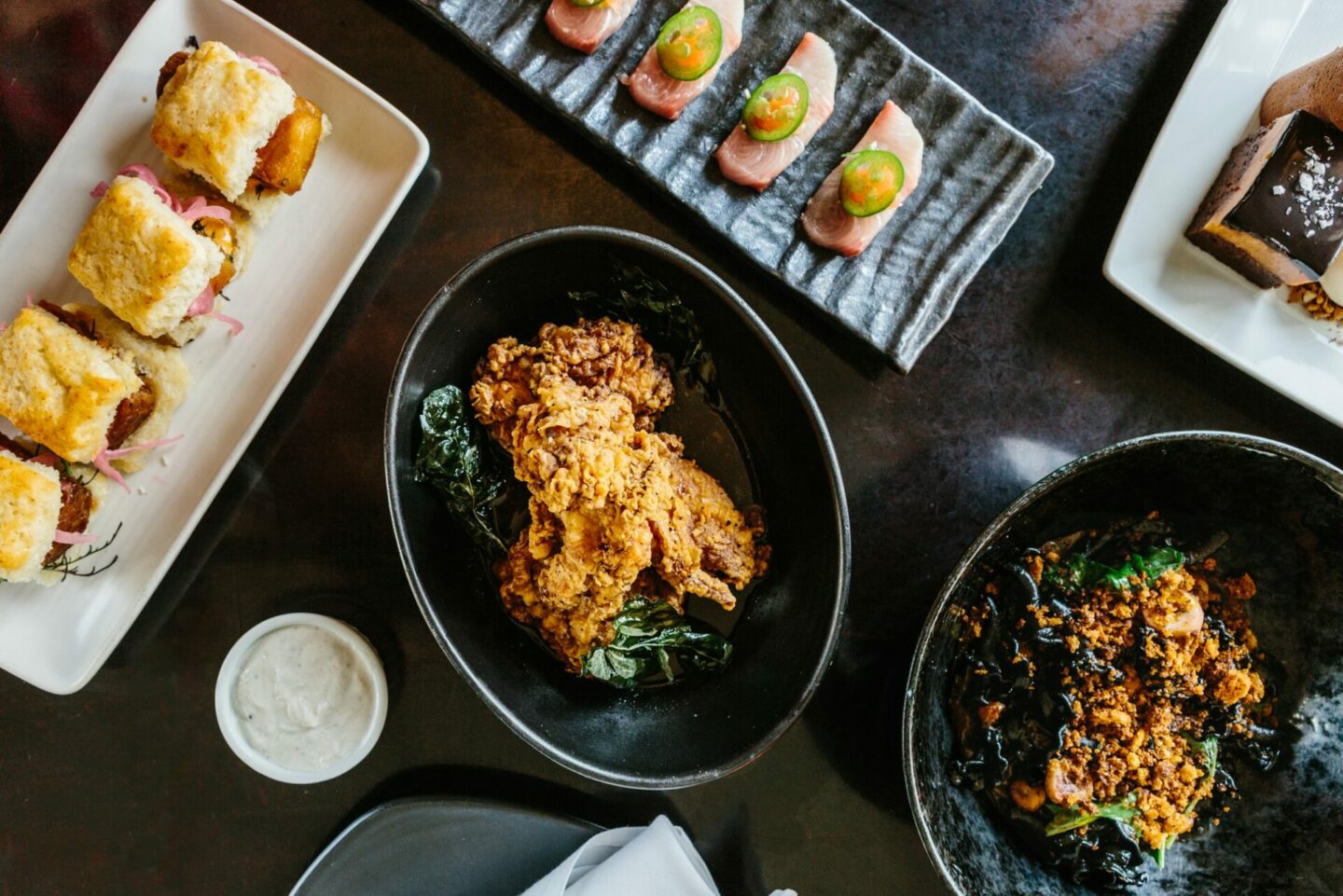 Fried chicken and other small bites photographed from above on a table