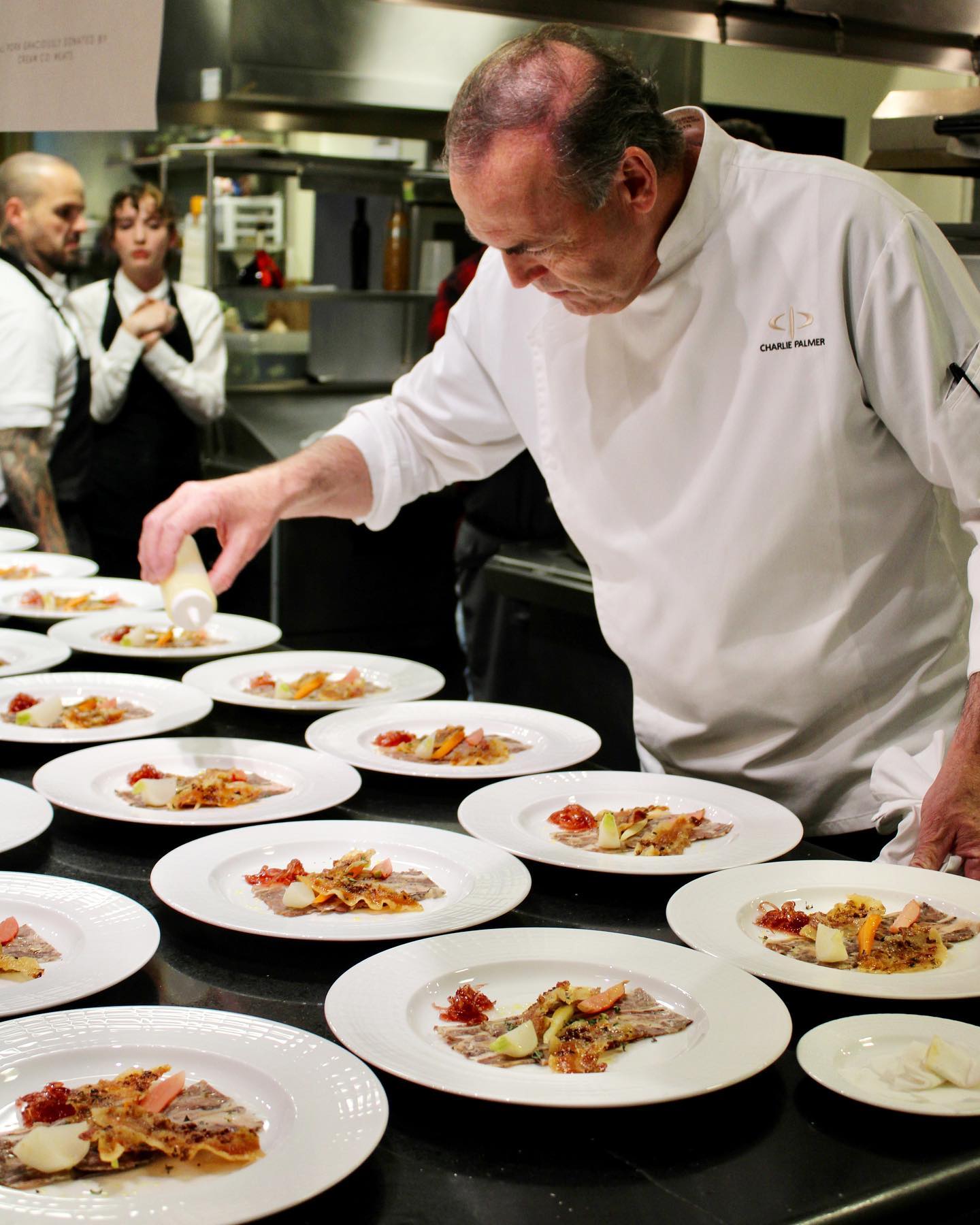 Chef Charlie Palmer preparing food at Dry Creek Restaurant