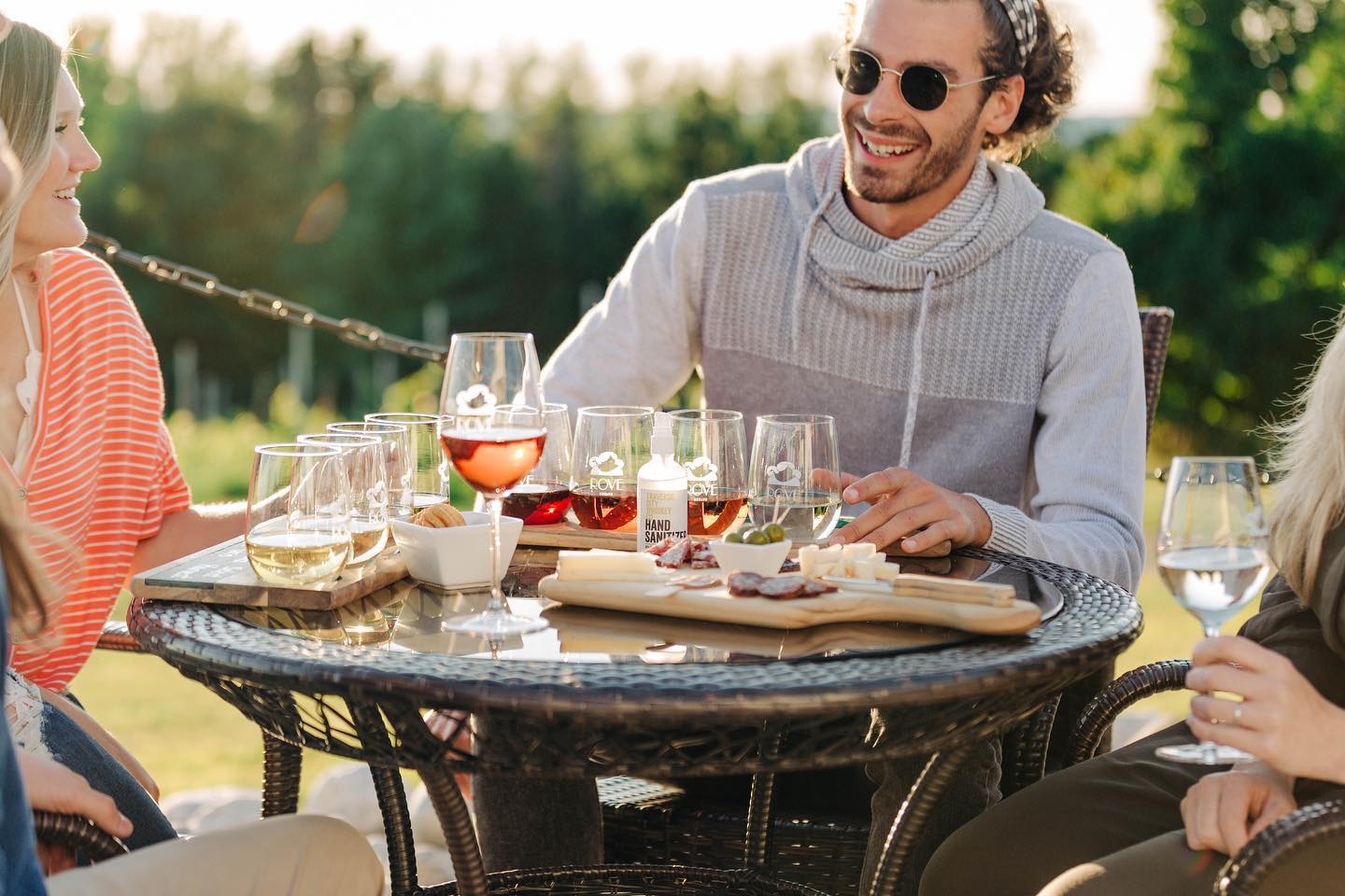 People enjoying wine and small bites at a tasting