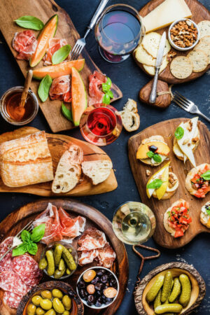 Italian wine shown with an assortment of Italian foods on a table
