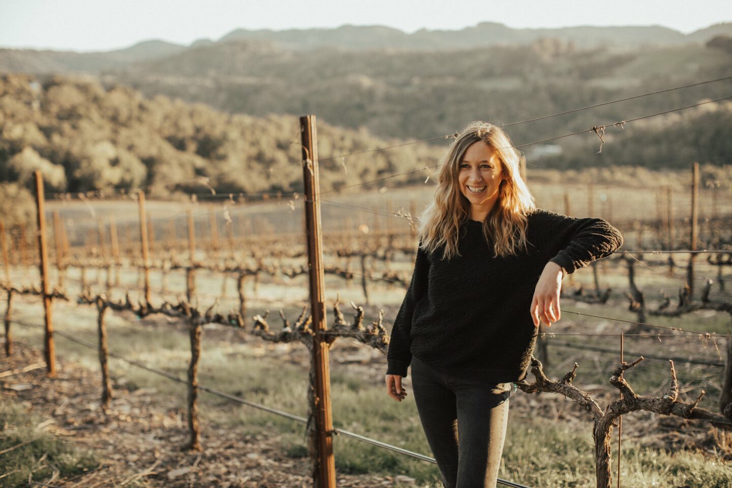 Riley Hubba posing for a photo in her vineyard