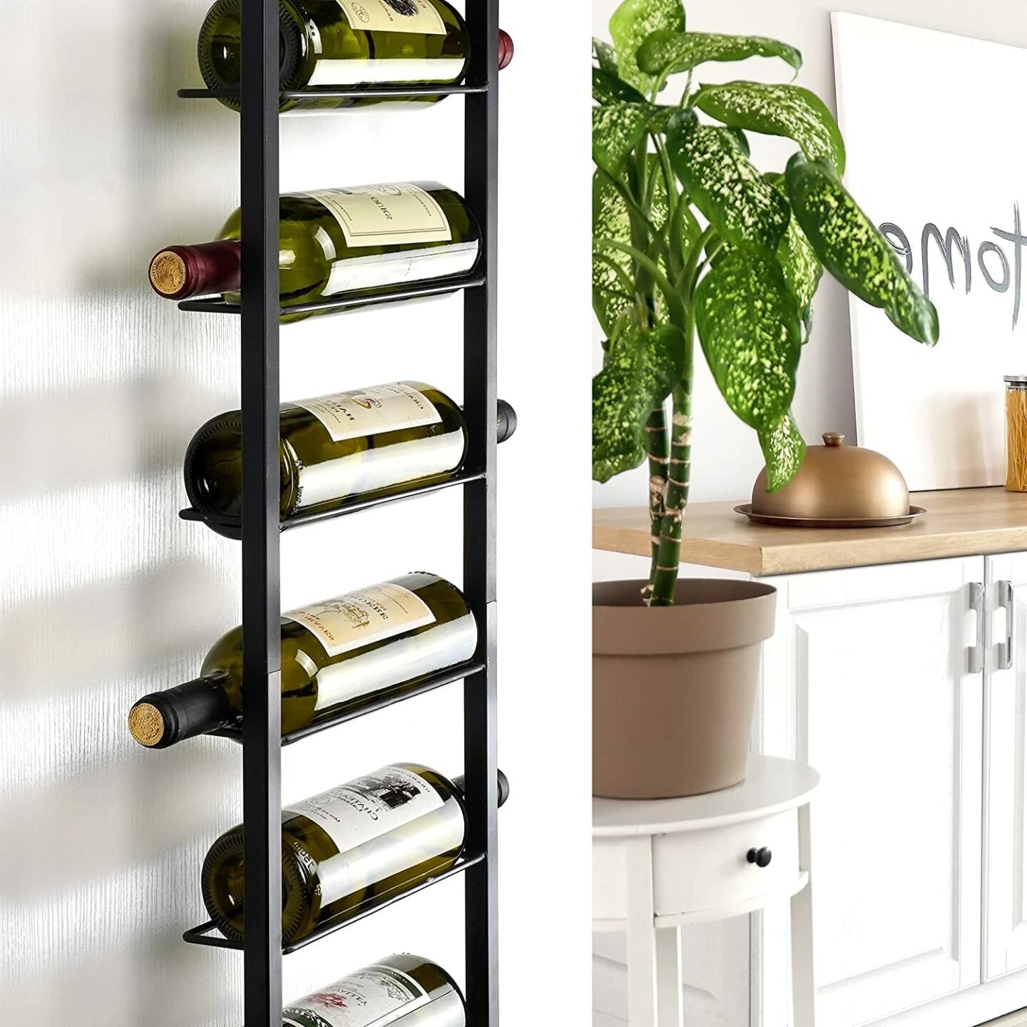 Black wrought iron wine rack hung on a white wall near cabinets