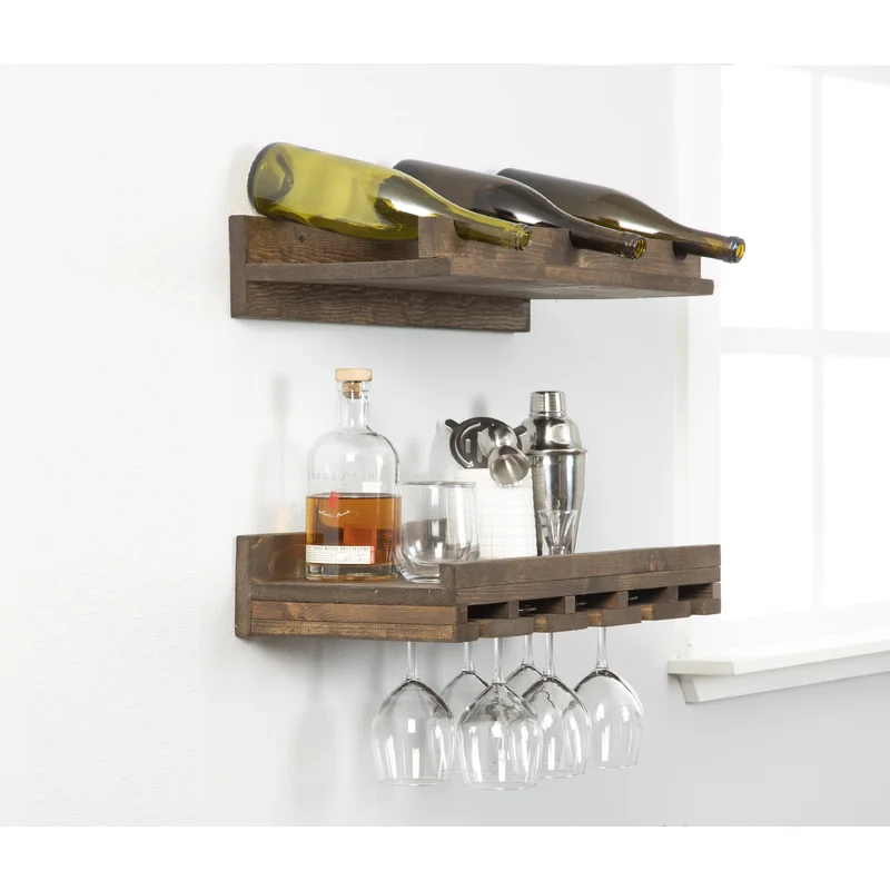 Wooden wine rack mounted to the wall holding glasses, bottles, and cocktail set