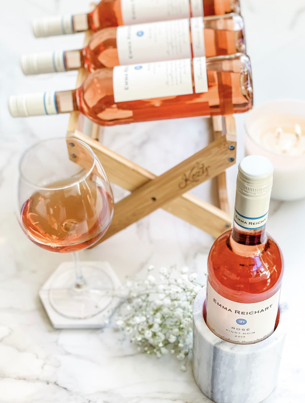 Small wooden wine rack sitting onto of a kitchen counter